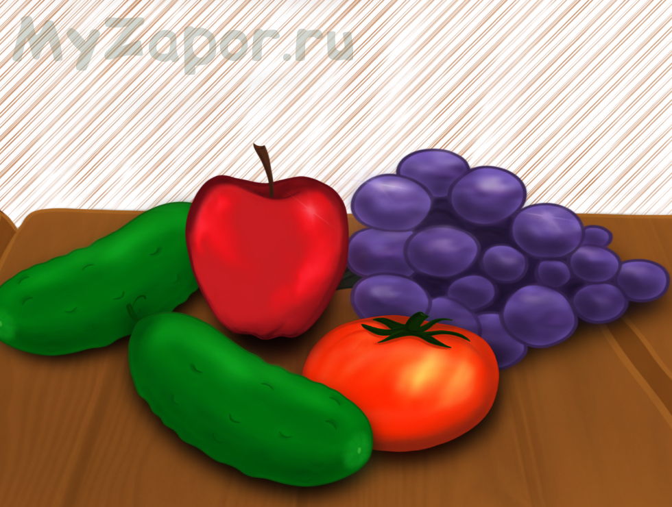 Яблоко, виноград, помидор и огурец на столе